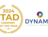 A gold laurel wreath reading ITAD of the Year 2024 appears beside the Dynamic Lifecycle Innovations logo, highlighting its IT asset disposition services and industry leadership.