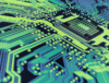Dynamic Lifecycle Innovations provides in-house electronics recycling, shown by a glowing microchip on blue and green circuit board patterns.